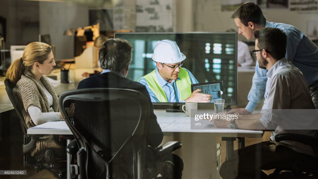 engineer presents customers on tablet video meeting